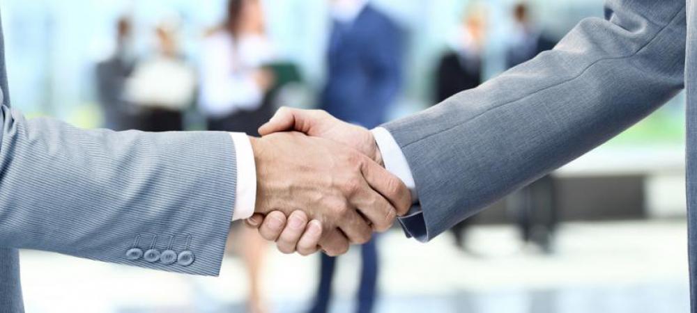 Konica Minolta Copiers San Francisco partners shaking hands